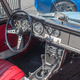 Fuller’s personal 1967 Datsun 2000 Roadster. He kept the restoration as close to stock as possible, but he did replace the Panasports with freshly some powdercoated steelies and whitewalls tires.